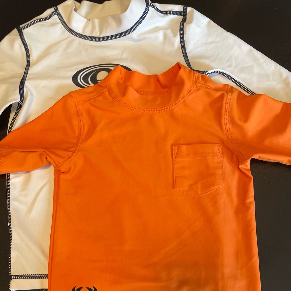 Bundle of (2) rash guards, boys sizes 12M and 24M.